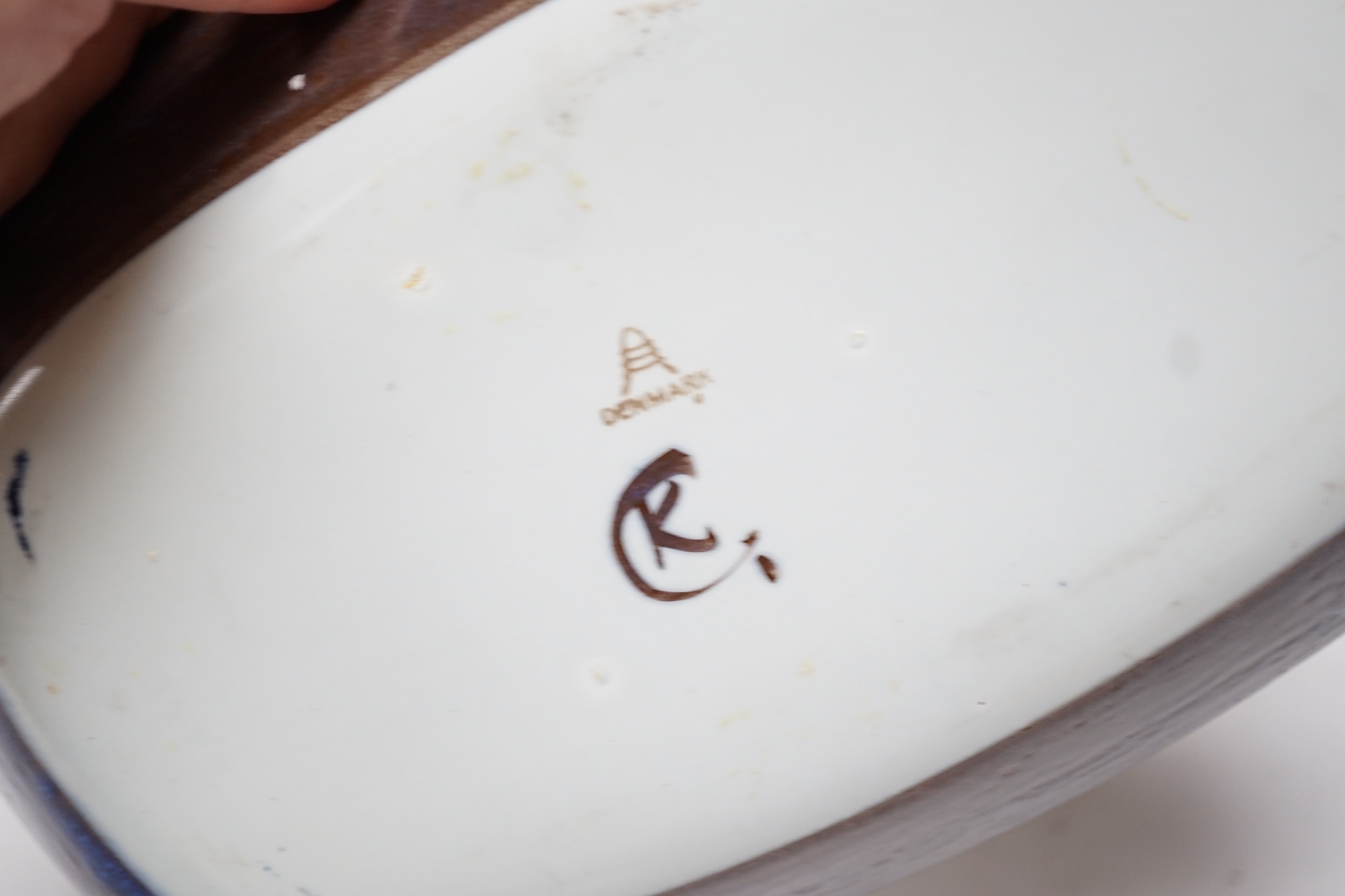 A pair of Royal Copenhagen pottery ‘fajance’ blue glaze vases and a squat jar and cover, together with an Alumina ware larger jar and cover and a rectangular tray signed CK, tallest 19cm